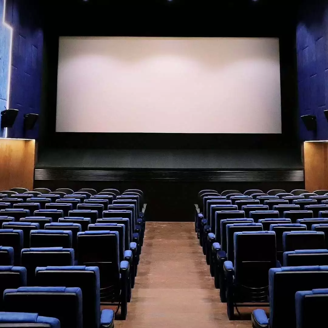 Ega Theatre's modern interior with large screen.
