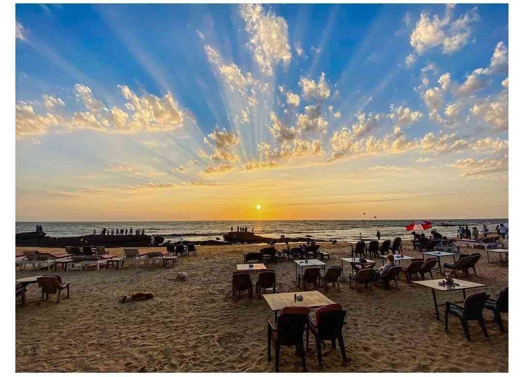 Anjuna Beach - Famous for its bohemian vibe, flea market, and rocky shoreline.