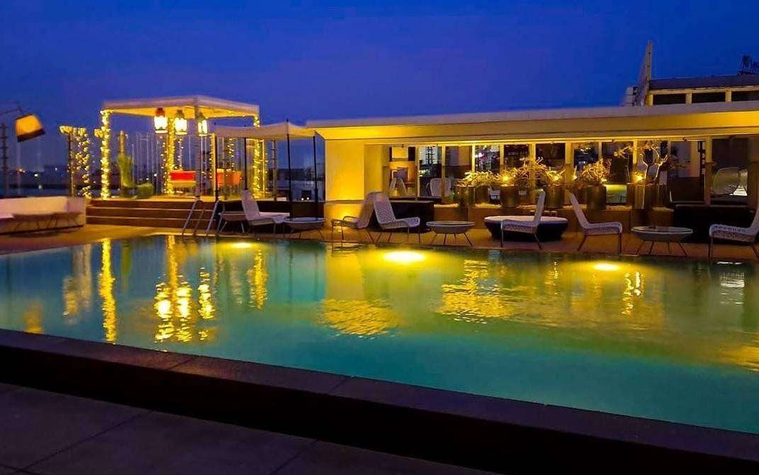 Aqua - Poolside dining with private cabanas.