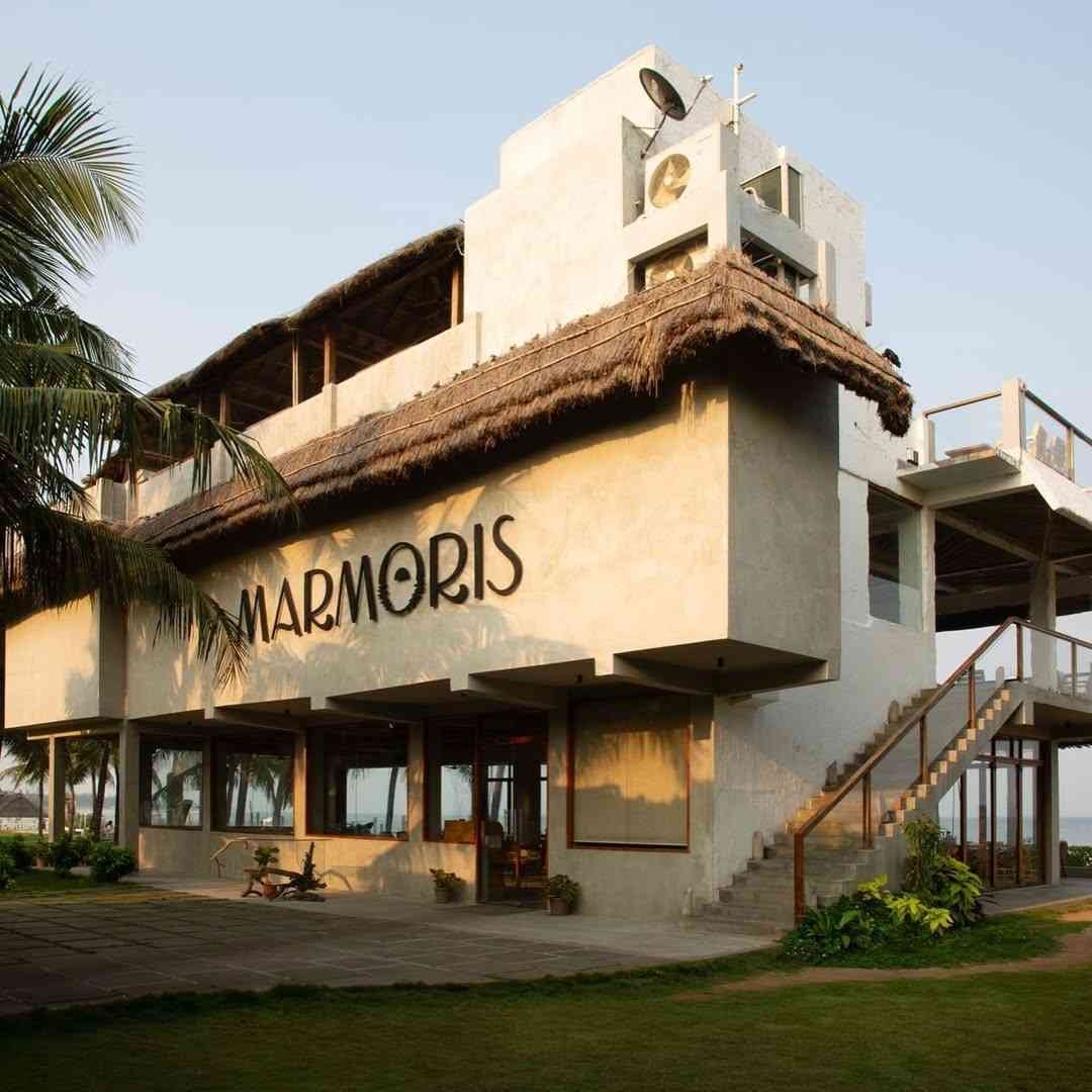 Marmoris Beach Lounge - Beachfront cafe with stunning ocean views and romantic ambiance.