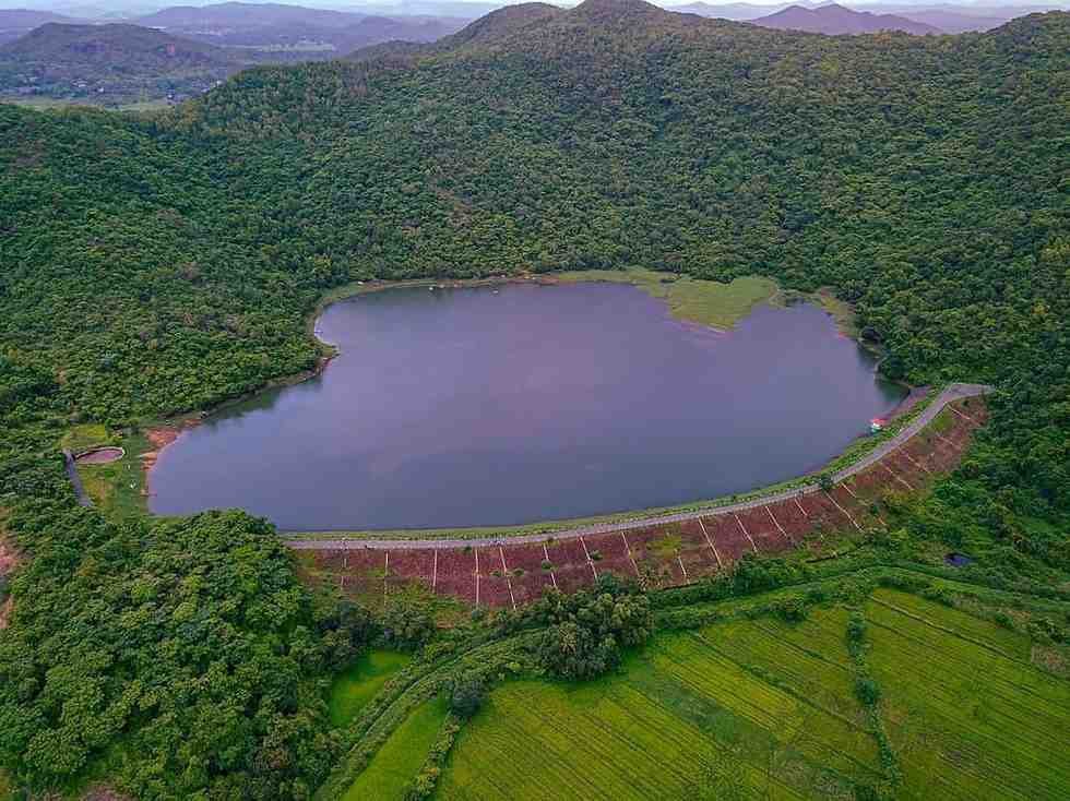 Sarzora Lake - A secluded, serene lake surrounded by lush mountains.